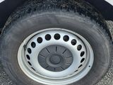 a close up of a tire on a white truck