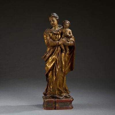 an image of a statue of a woman holding a child