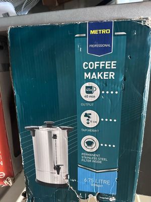 a box of coffee maker sitting on a shelf