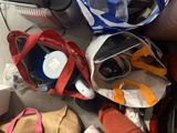 many bags that are sitting on the floor next to each other