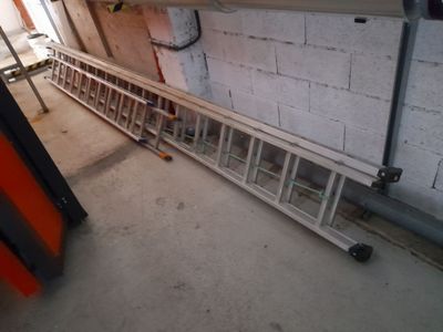 a ladder that is leaning against a wall in a room