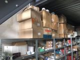 many boxes stacked on the shelves in the garage