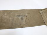 a close up of a brown canvas belt with a small patch on it