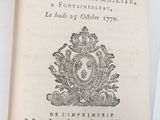 an open book with a picture of a coat of arms and a crown on it