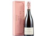 the bottle of wine is next to a pink box