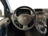 dashboard of a small car with a steering wheel and dashboard controls