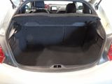 a trunk of a car with the back seat folded open