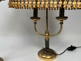 a lamp that is sitting on a table next to a lamp