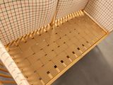an image of a wooden chair with a plaid seat