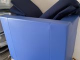 a blue box with pillows on top of it