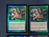 three cards with different animals on them are sitting on a table