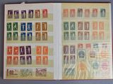 un livre ouvert avec des timbres sur une table
