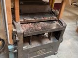 a machine that is sitting on a table in a garage