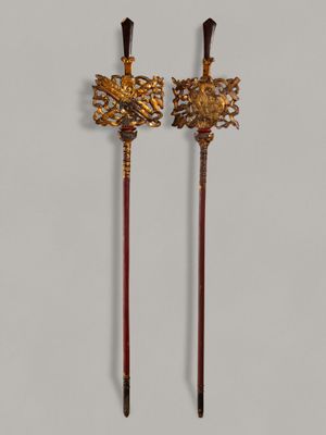 a pair of antique brass and wood canes with flowers on them