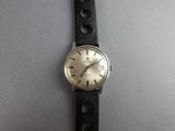 a close up of a wrist watch with a black leather strap