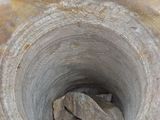 a small pile of rocks in the middle of a stone vase