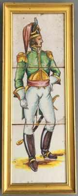 tableau représentant un homme en uniforme militaire, dans un cadre doré