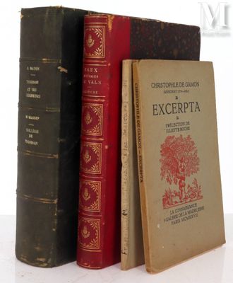 three books that are sitting on a white table