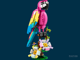 a lego parrot sitting on top of a tree branch