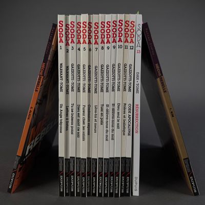 books stacked on top of each other on a gray surface