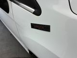 a sticker on the side of a white car