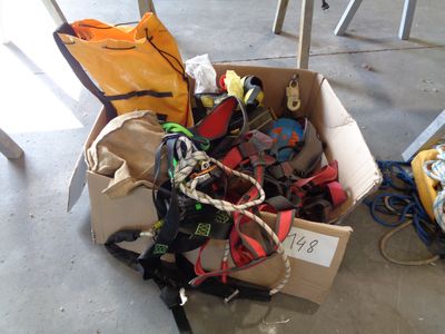 a cardboard box filled with assorted items sitting on the floor