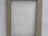 a wooden picture frame with a white background