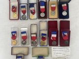 many medals and medals displayed on a white surface