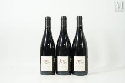 three bottles of wine sit on a white surface with a white background