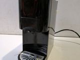 a coffee maker that is sitting on a table