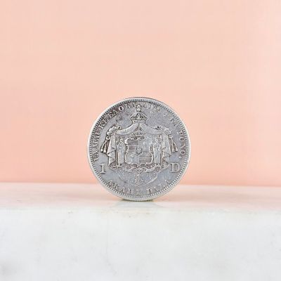 a close up of a coin sitting on top of a table