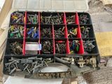 many different types of screws in a tool box