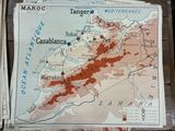 a map on a table with a bunch of papers
