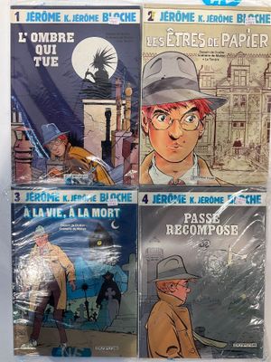 quatre bandes dessinées posées sur une surface blanche avec un fond bleu