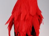 red feathered hat on a mannequin head on a mannequin mannequin mannequin mannequin mannequin mannequin manne