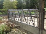 a bridge that has been built over a dirt field