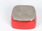 a close up of a red and silver object