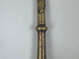 a tall metal object that is on a wall
