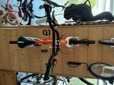 a bike that is hanging on the wall next to other bikes