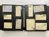 an image of a black folder with a lot of stamps on it