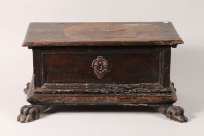 an old wooden box with a heart on the lid