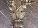 a close up of a decorative object on a wooden floor