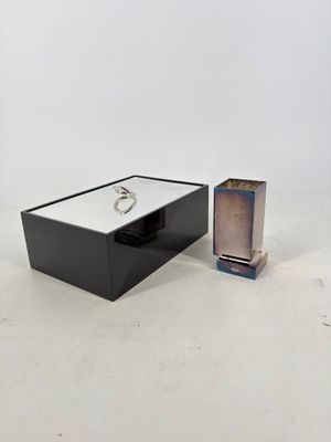 an image of a box with a ring on it and a box with a ring on it