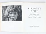 an open book with a black and white photo of a girl ' s face