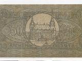 un ancien billet de banque sur lequel figure l'image d'un bâtiment