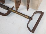 a large metal tool that is laying on the floor