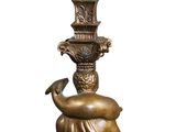 bronze statue of a woman holding a vase on top of her head