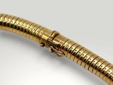 an image of a gold pen with a snake head on it