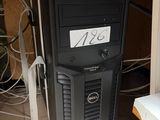 a computer tower with a keyboard and mouse on top of it
