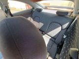a view of the back seats of a car from the driver ' s seat